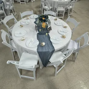 Premium white resin chairs, round tables, and white linen