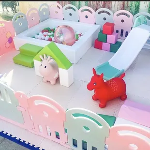 Soft play setup with strawberry theme colors.