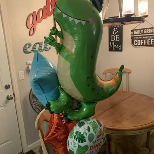 Dino balloon bouquet with added balloons