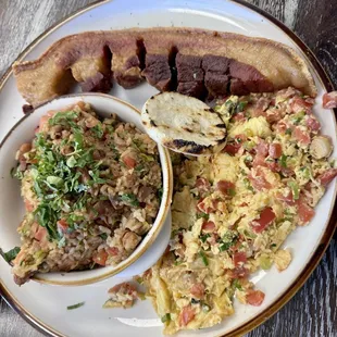 Chicharron breakfast with rice and beans, and eggs.