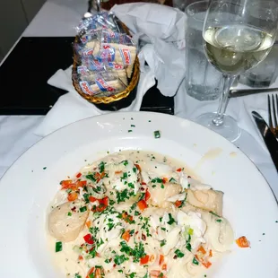 Crabmeat &amp; Scallops Sautéed in olive oil, green onions, and red peppers with a cream sauce served over pasta