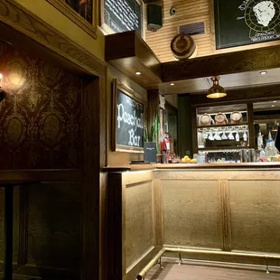 The bar and entrance to chesterfield sofa seating area