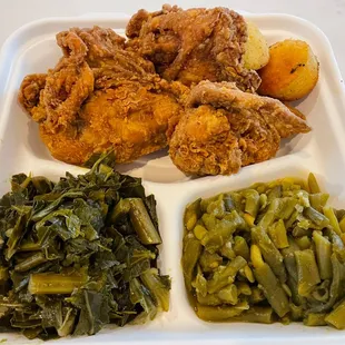 Three piece fried chicken meal with green beans and collards