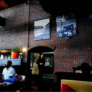 people sitting at tables in a restaurant