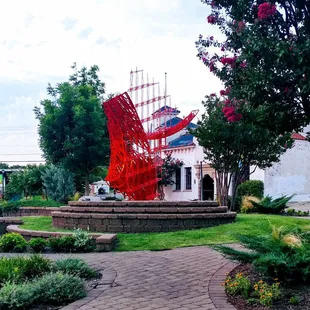 A center piece of art on an island in the center of the Paseo Arts District.
