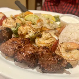 a plate of grilled meat and vegetables