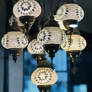 a number of hanging lamps
