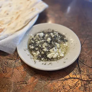 a plate of pita bread and a glass of beer