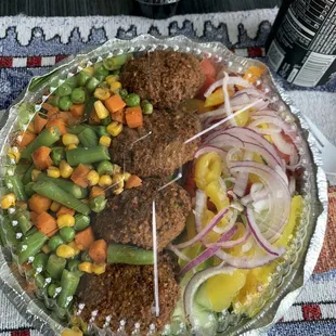 Falafel 4pcs on salad with green sauce- delicious!