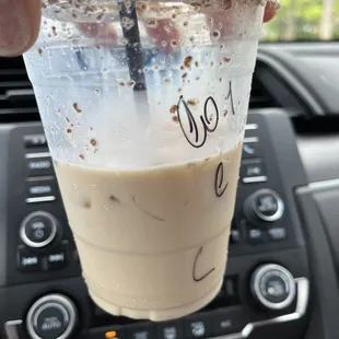 a hand holding a cup of coffee