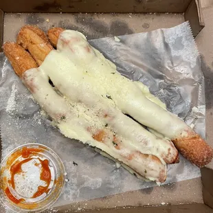 Literal breadsticks with a slice of cheese on top
