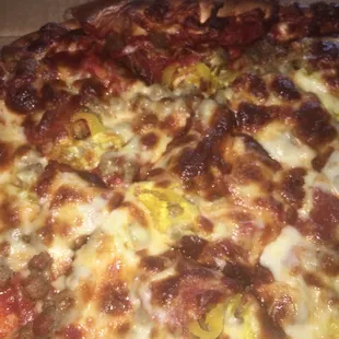 Large pepperoni, sausage, and banana peppers pizza