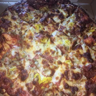 Large pepperoni, sausage, and banana peppers pizza