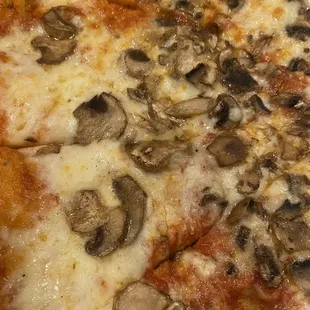 a pizza with mushrooms