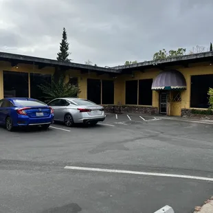 two cars parked in a parking lot