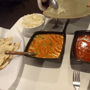 rice comes with the indian chicken dishes.  Order of Naan alongside