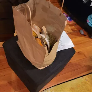 a cat sniffing a bag of food