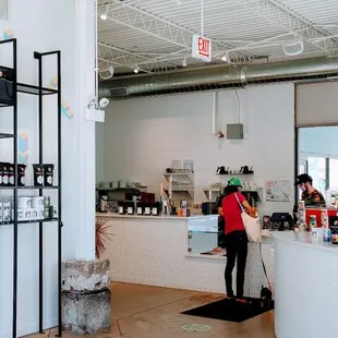 a woman standing at the counter