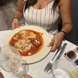 a woman holding a plate of food