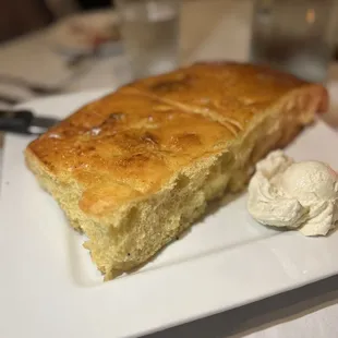 a piece of bread and a scoop of ice cream