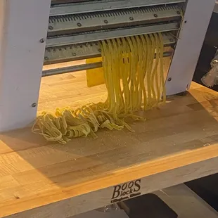 Fettuccine being cut