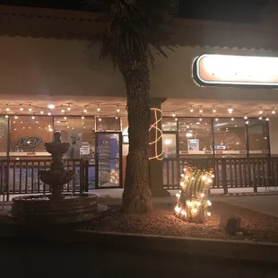 the outside of a restaurant at night