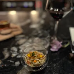 a glass of wine and a plate of food