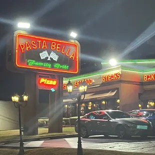 cars parked in front of a restaurant