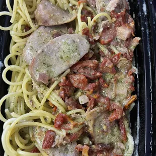 Spaghetti Creamy Pesto + Italian sausage, pancetta, and sundried tomatoes