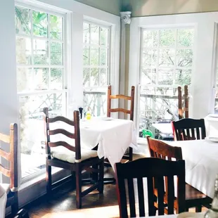 a dining room with tables and chairs