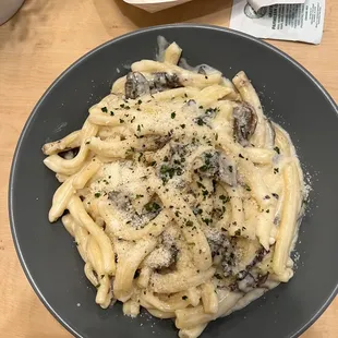 The truffle Chefs Pasta with Alfredo mushrooms and Truffle oil. To die for!