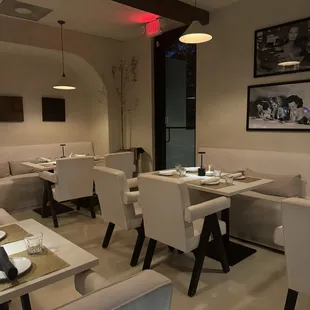 a dining area with tables and chairs