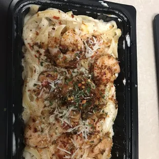 Spicy Shrimp Alfredo. Two layers of shrimp in here and I didn't expect that either. Amazing food!!