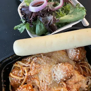 Spaghetti and meatballs for lunch with a small salad and breadstick