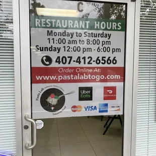 a restaurant hours sign