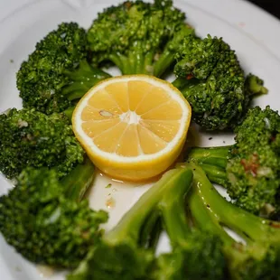 broccoli and lemon on a plate