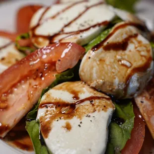 a closeup of a salad with mozzarella and tomatoes