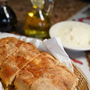 a basket of bread and a bowl of rice