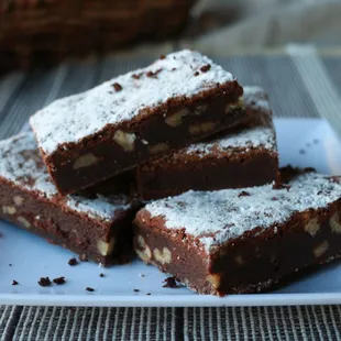 a stack of brownies on a plate