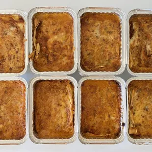 a variety of baked food in plastic containers