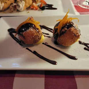 Sfinci (ricotta doughnut balls filled with orange vanilla cream)