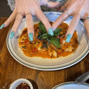 a woman's hands on a plate
