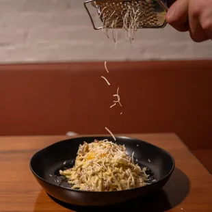 grated cheese being grated