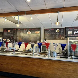 a restaurant counter with a variety of food items