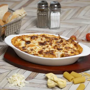 Combinazione
3 types of pasta covered in Bolognese sauce and topped with mozzarella cheese, baked in the over (el forno) 
Deliziosa!