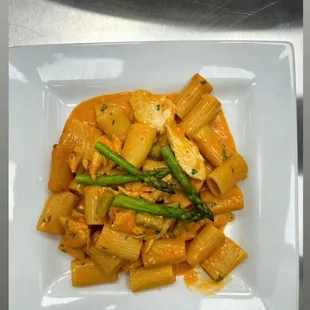 a plate of pasta and asparagus