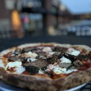 a pizza on a plate on a table