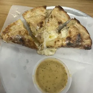 Chicken &amp; Cheese Calzone with Crawfish Jubilee Sauce.