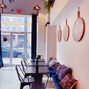 a dining room with a long table and chairs