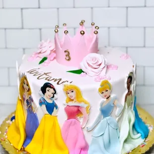 a cake with princesses on it